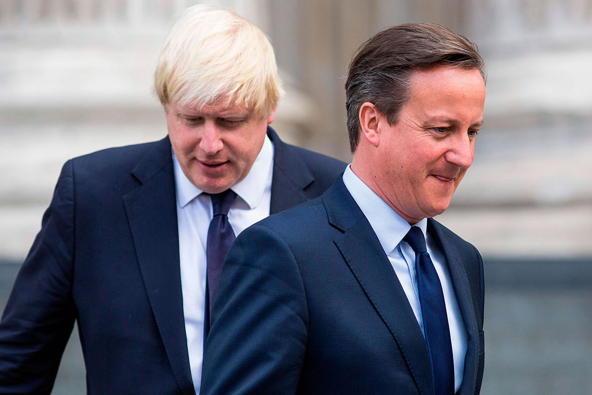In this file photo taken on 07 July 2015 British prime minister David Cameron (R) and London mayor Boris Johnson leave St Paul`s Cathedral in central London after attending a memorial service in memory of the 52 victims of the 7/7 London attacks. Photo: AFP