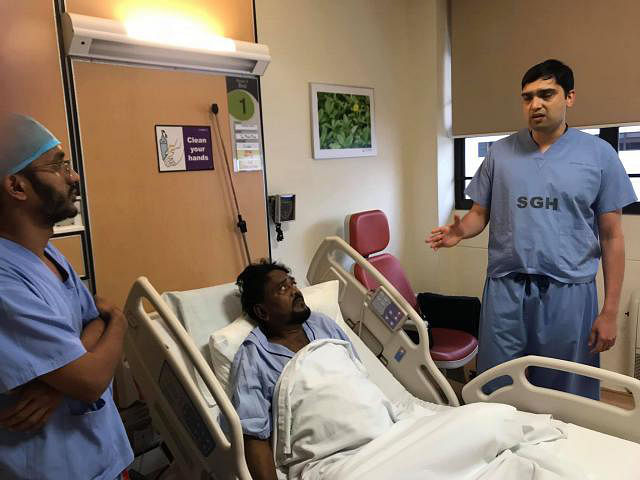 Andrew Kishore at Singapore hospital with physicians. Photo: Facebook