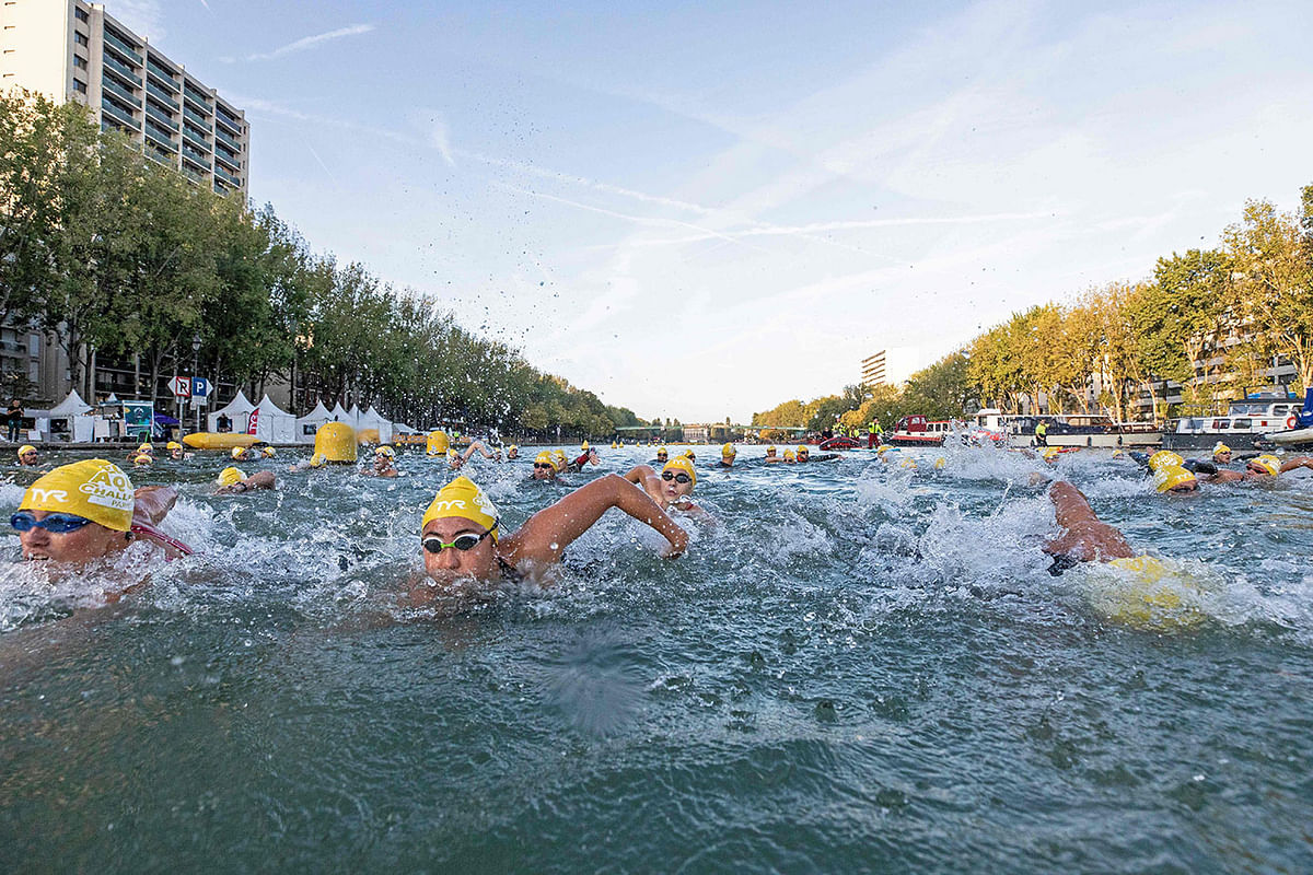 A swimmer attends the open swim stars 10km open waters swimming competition at canal de l`Ourcq, Northeastern Paris on 14 September 2019. Photo: AFP