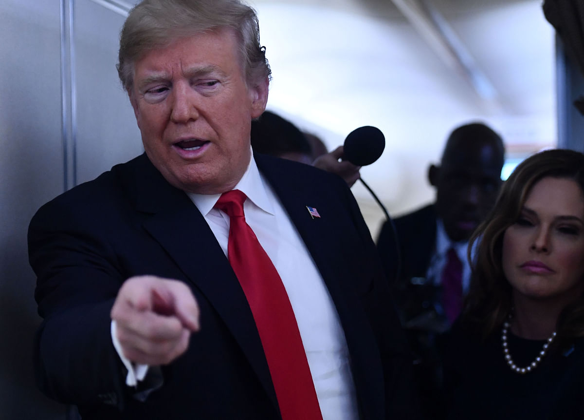 In this file photo taken on 6 October 2018 US president Donald Trump speaks to reporters upon arrival in Topeka, Kansas, on the confirmation of Brett Kavanaugh to the Supreme Court. Photo: AFP