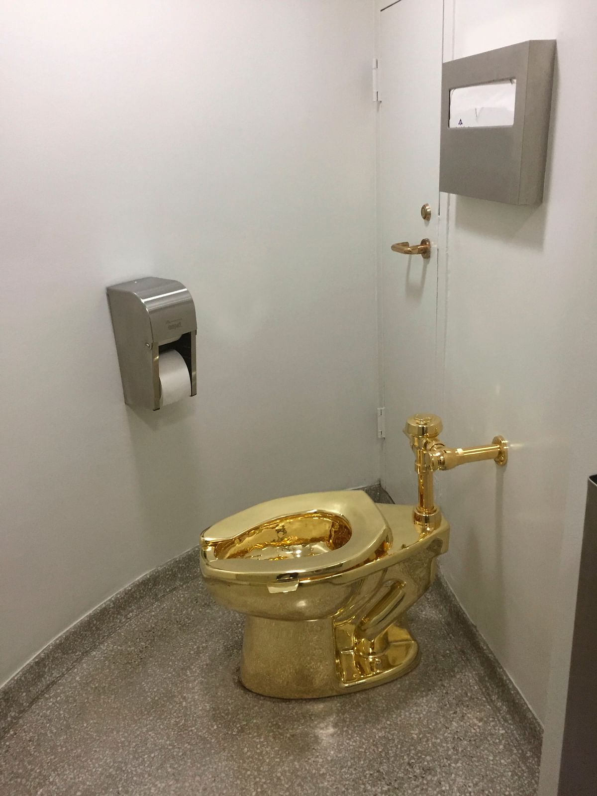 In this file photo taken on 15 September 2016, a fully functioning solid gold toilet, made by Italian artist Maurizio Cattelan, is going into public use at the Guggenheim Museum in New York. Photo: AFP