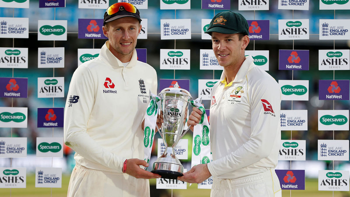 England`s Joe Root and Australia`s Tim Paine pose for a photo with the Ashes trophy after drawing the series in Kia Oval, London, Britain on 15 September, 2019