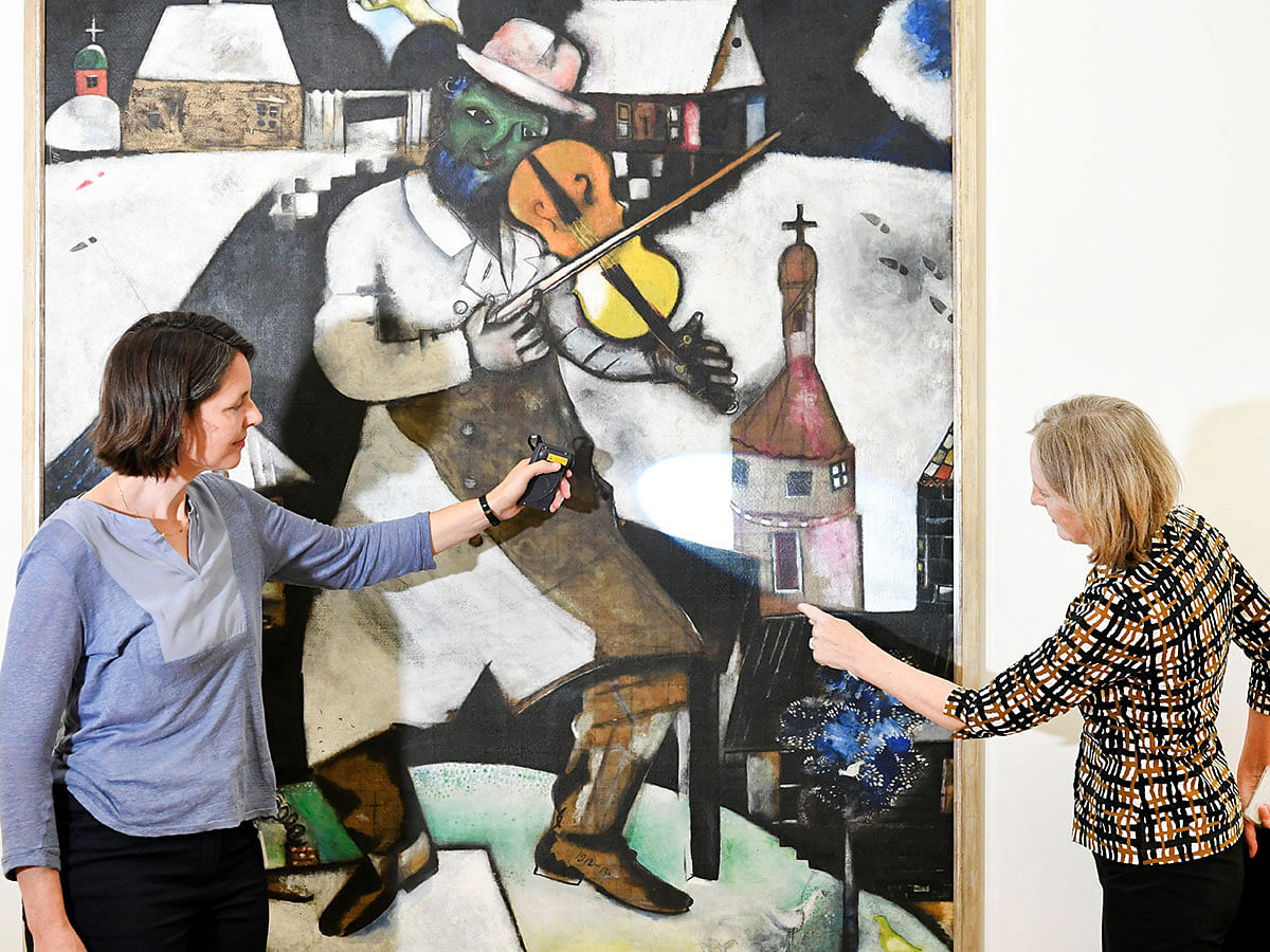 Conservators Meta Chavannes and Madeleine Bisschoff speak about a study on a collection of Marc Chagall`s artwork in the conservation atelier of the Stedelijk Museum in Amsterdam, Netherlands on 13 September 2019. Photo: Reuters