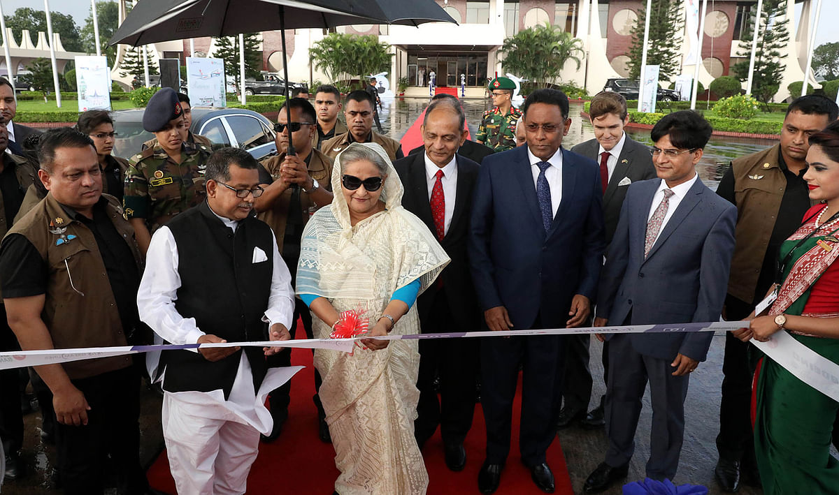 Prime minister Sheikh Hasina formally commissions the newly-procured state-of-the-art aircraft of Bangladesh Biman’s fourth Dreamliner, ‘Rajhangsa’, by cutting a ribbon at the VVIP Tarmac of HSIA , Dhaka on Tuesday afternoon. Photo: PID