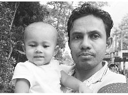 Farid Uddin with his daughter. Photo: Collected
