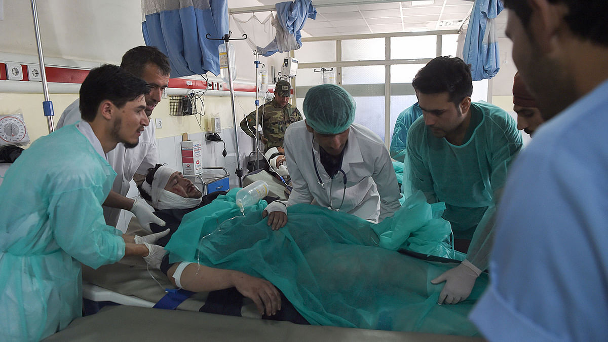 A wounded man receives treatments at the Wazir Akbar Khan hospital following a blast, in Kabul on Tuesday. A suicide bomber killed at least 24 people outside a campaign rally for Afghan President Ashraf Ghani on Tuesday, less than two weeks ahead of elections which the Taliban have vowed to disrupt. Photo: AFP