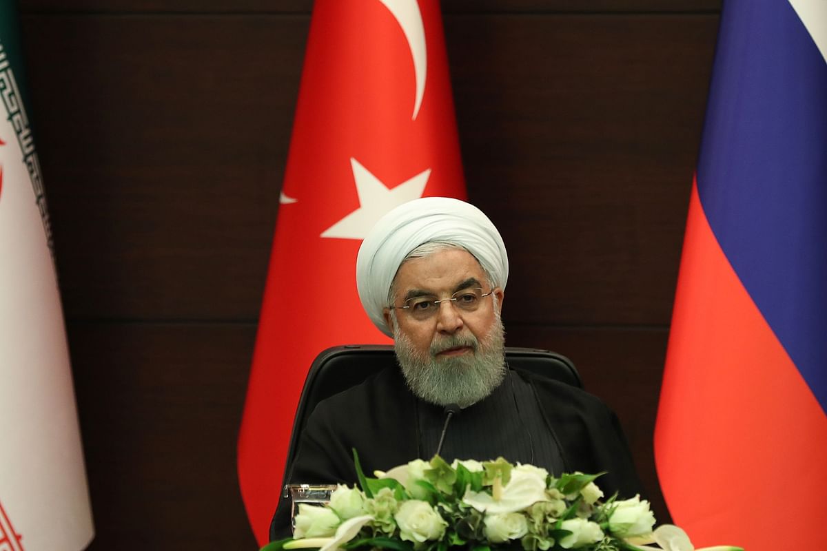 Iranian president Hassan Rouhani speaks during a joint press conference with Turkish and Russian counterparts following a trilateral meeting on Syria, in Ankara on 16 September. Photo: AFP