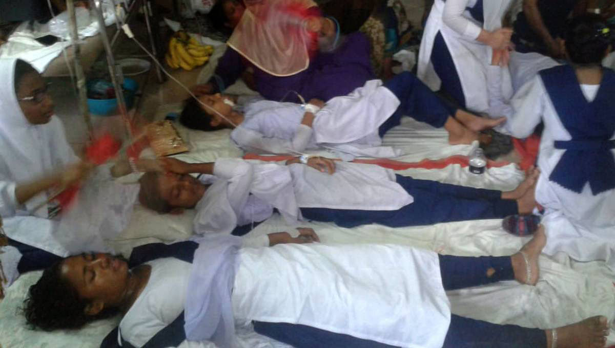 More than 100 students of Dorgram Bohumukhi High School at Shaturia in Manikganj fell sick after being forced to clean the schoolyard on Wednesday. Photo: UNB