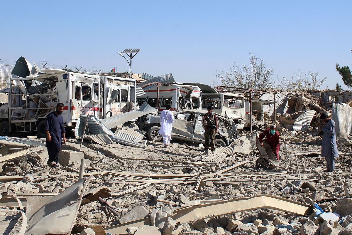 Afghan security forces investigate the site where a Taliban car bomb detonated near an intelligence services building in Qalat in Zabul province on 19 September 2019. Photo: AFP