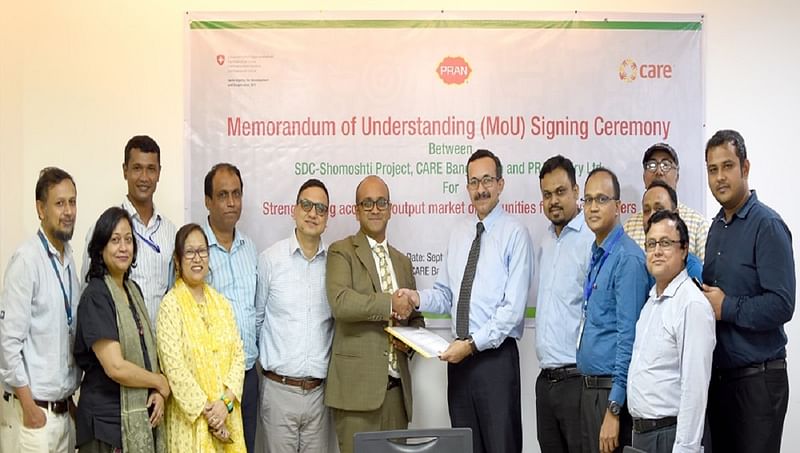 CARE Bangladesh, PRAN Dairy sign MoU for rural dairy development. Photo: UNB