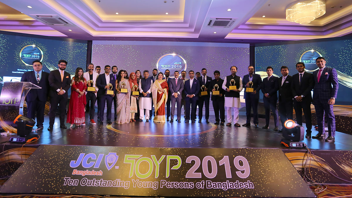 Ten young persons with Junior Chamber International Bangladesh awards pose with speaker of Bangladesh Jaitya Sangsad, Shirin Sharmin Chaudhury, among others on Wednesday. Photo: Collected