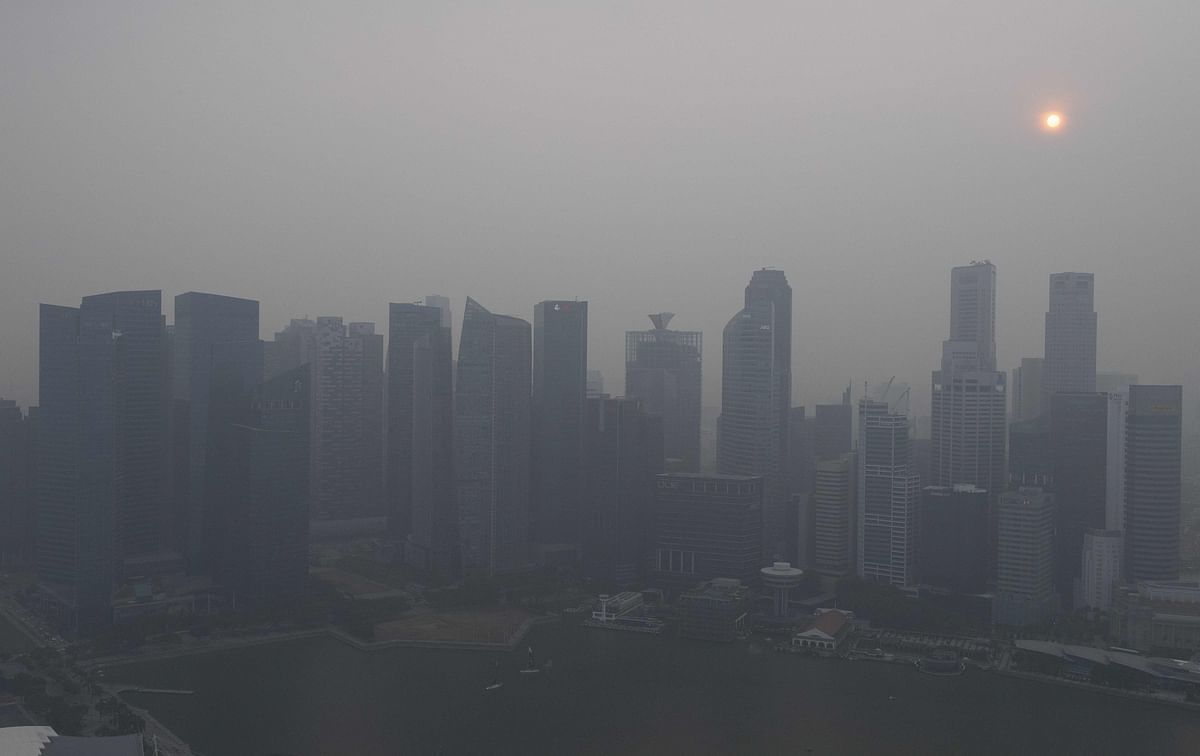 Buildings are seen as haze blankets the skyline of Singapore on 18 September 2019. Photo: AFP