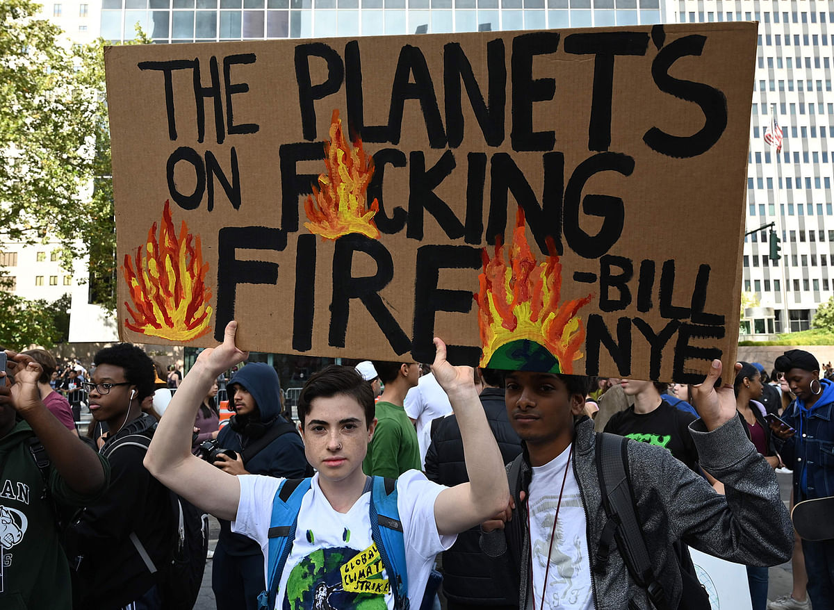 People gather during the Global Climate Strike march at Foley Square in New York 20 September, 2019. Photo: AFP