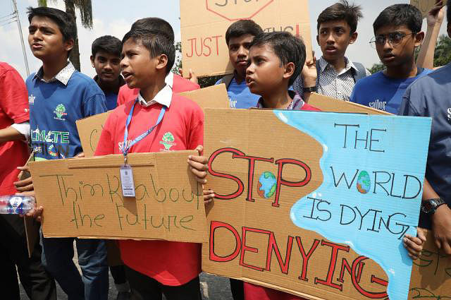 Students of different schools hold placard. Photo: Prothom Alo