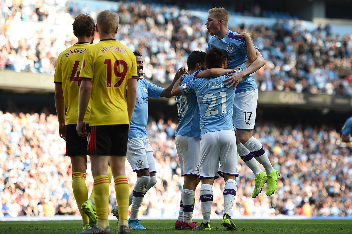 Manchester City`s Portuguese midfielder Bernardo Silva celebrates with teammates after he scores the team`s sixth goal during the English Premier League football match between Manchester City and Watford at the Etihad Stadium in Manchester, north west England, on 21 September, 2019. Photo: AFP