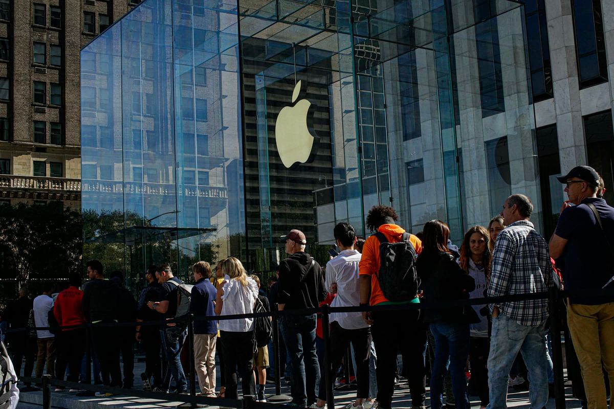 Costumers visit the newly renovated Apple Store at Fifth Avenue on 20 September 2019 in New York City. Photo: AFP  Apple first to use recycled rare earth materials in new iPhones