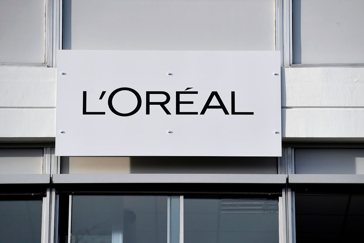 In this photo taken on 16 February 2018 shows a board with the L`Oreal logo outside of the L`Oreal plant, in Lassigny. Cosmetics maker L’Oreal will pay 320 million euros after they reached a settlement with French tax authorities. Photo: AFP