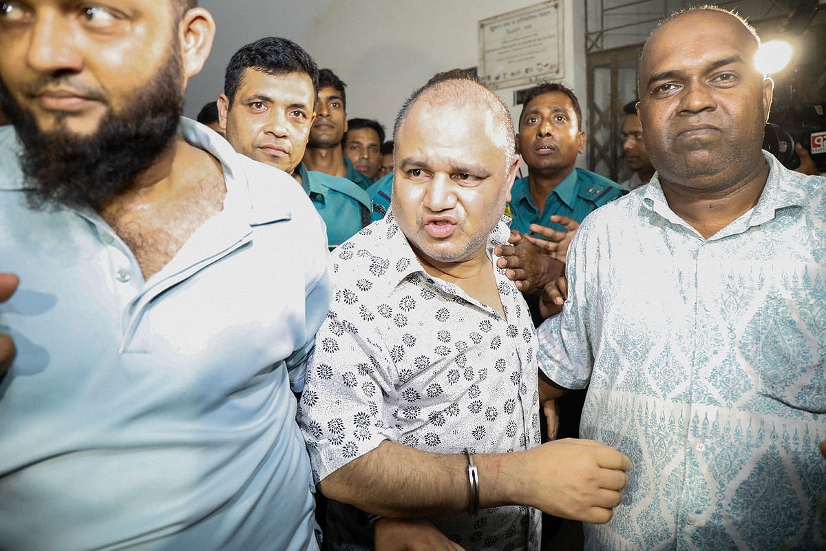 GK Shamim (middle) being brought before a Dhaka court on 21 September, 2019. Photo: Dipu Malakar