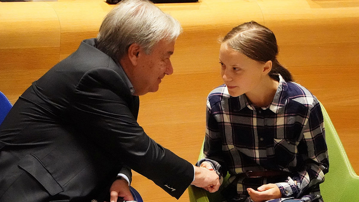Secretary-General of the United Nations Antonio Guterres shakes hands with Swedish environmental activist Greta Thunberg at the Youth Climate Summit at United Nations Headquarters in the Manhattan borough of New York, US, 21 September 2019. Photo: Reuters