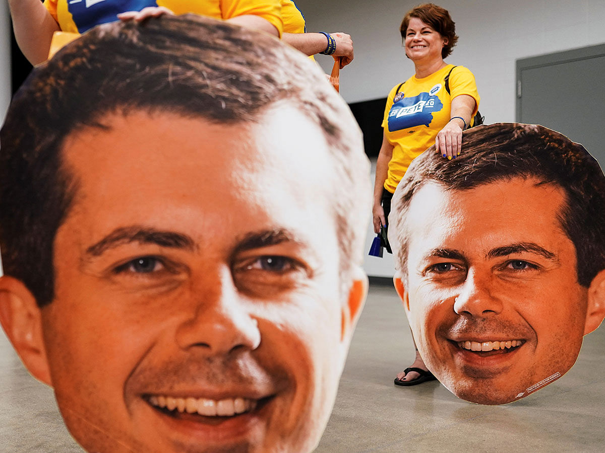 Two supporters hold large cutouts of Pete heads at a campaign event for Pete Buttigieg, South Bend Mayor and Democratic presidential hopeful in Newton, Iowa, US, on 21 September 2019. Photo: Reuters