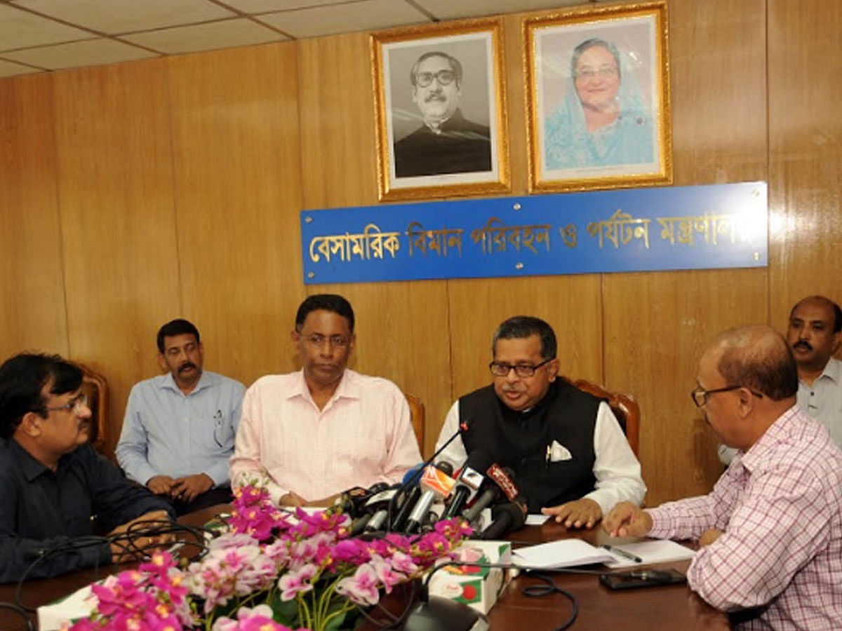 Civil aviation and tourism affairs state minister Md Mahbub Ali (3rd R) talks to media as secretary Md Mohibul Haque listens at the ministry`s conference room on Tuesday. Photo: PID