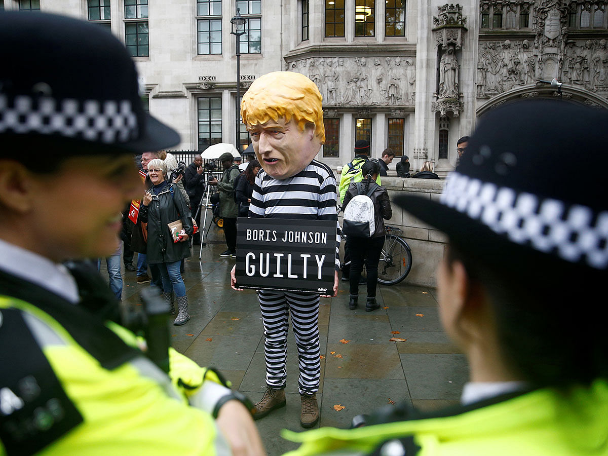 A protester stands outside the Supreme Court of the United Kingdom after the hearing on British Prime Minister Boris Johnson`s decision to prorogue parliament ahead of Brexit, in London, Britain on 24 September 2019. Photo: Reuters