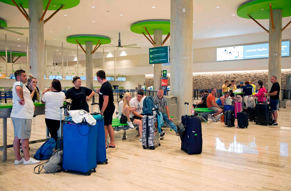 Passengers left stranded after the collapse of British travel firm Thomas Cook remain at Punta Cana`s international airport, in the Dominican Republic, on 23 September. Photo: AFP