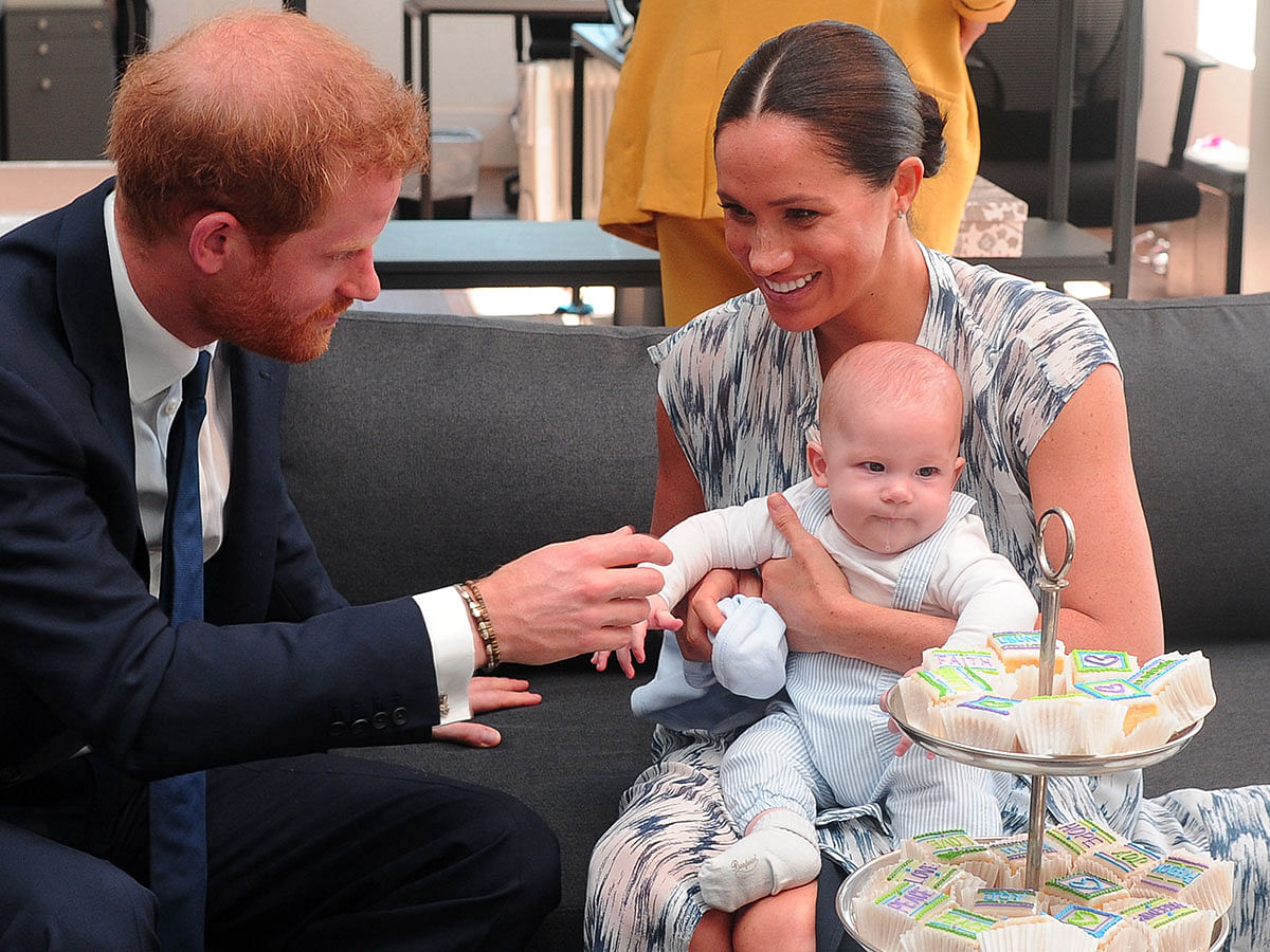 Britain`s Duke and Duchess of Sussex, Prince Harry and his wife Meghan hold their baby son Archie as they meet with Archbishop Desmond Tutu (unseen) at the Tutu Legacy Foundation in Cape Town on 25 September 2019. Photo: AFP