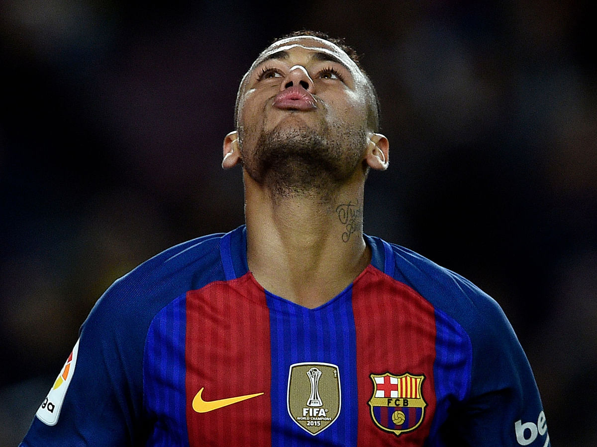 In this file photo taken on 19 November 2016 Barcelona`s Brazilian forward Neymar gestures during the Spanish league football match FC Barcelona vs Malaga CF at the Camp Nou stadium in Barcelona, on 19 November 2016. Photo: AFP