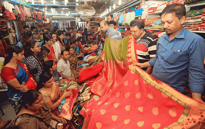 Shoppers busy buying sarees at a shop on in Chattogram`s Dewanji Pukurpar on 27 September, 2019 ahead of Durga Puja, the biggest religious festival of the Hindus. Photo: Jewel Shil