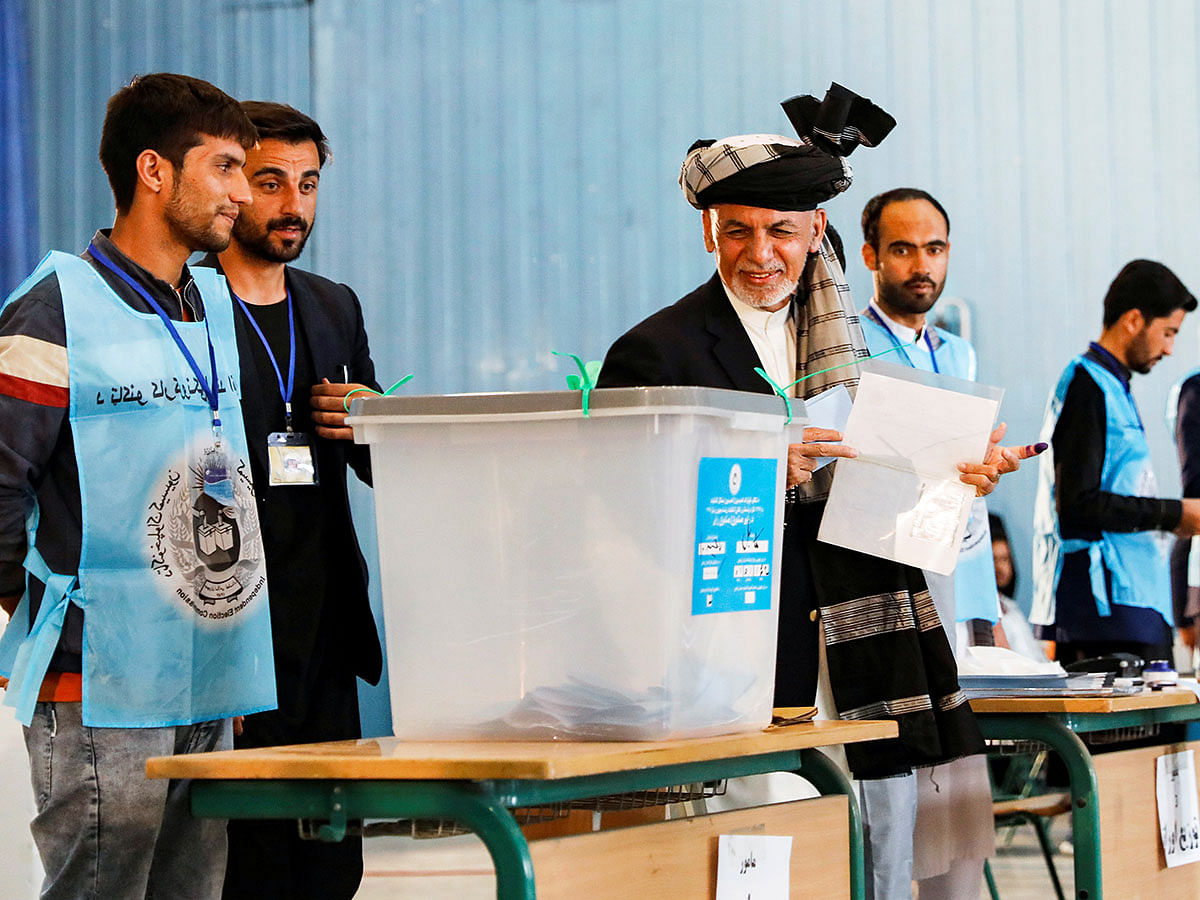 Afghan presidential candidate Ashraf Ghani arrives to cast his vote in the presidential election in Kabul, Afghanistan. Photo: Reuters