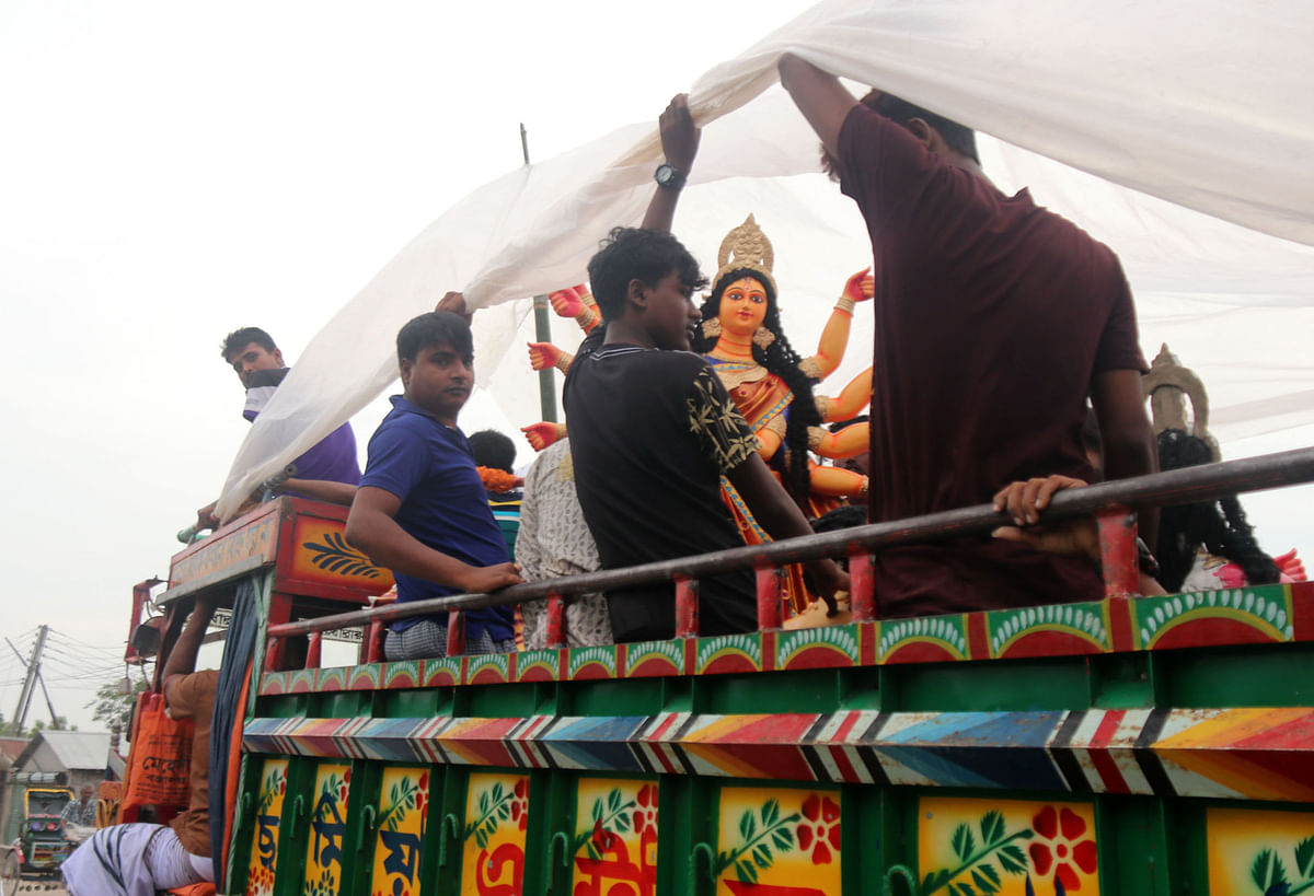 5Devotees carry a statue of Hindu goddess Durga ahead of the annual Durga celebrations on a truck at Gangni upazila of Meherpur on 28 September. Photo: Hasan Mahmud