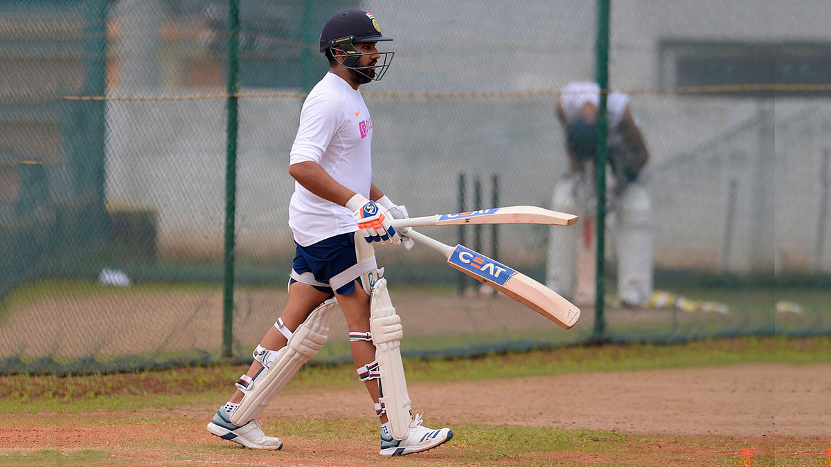Indian cricketer Rohit Sharma (L) bats in the nets during a practice session prior to the first test match between India and South Africa at the Dr. Y.S. Rajasekhara Reddy ACA-VDCA Cricket Stadium in Visakhapatnam on 30 September 2019. Photo: AFP