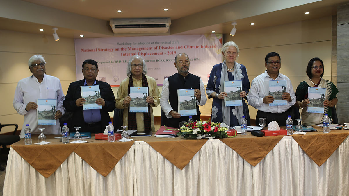 Draft document of National Strategy on the Management of Disaster and Climate Induced Internal Displacement presented to Enamur Rahman, state minister for disaster management and relief, at a workshop at BRAC Centre Inn in the capital on Tuesday. Photo: Collected