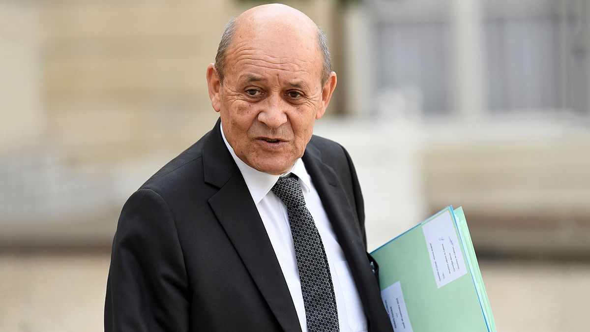 France`s foreign minister Jean-Yves Le Drian gestures as he leaves The Elysee Presidential Palace in Paris on 30 September 2019, following a luncheon after a church service for former French President Jacques Chirac. Photo: AFP