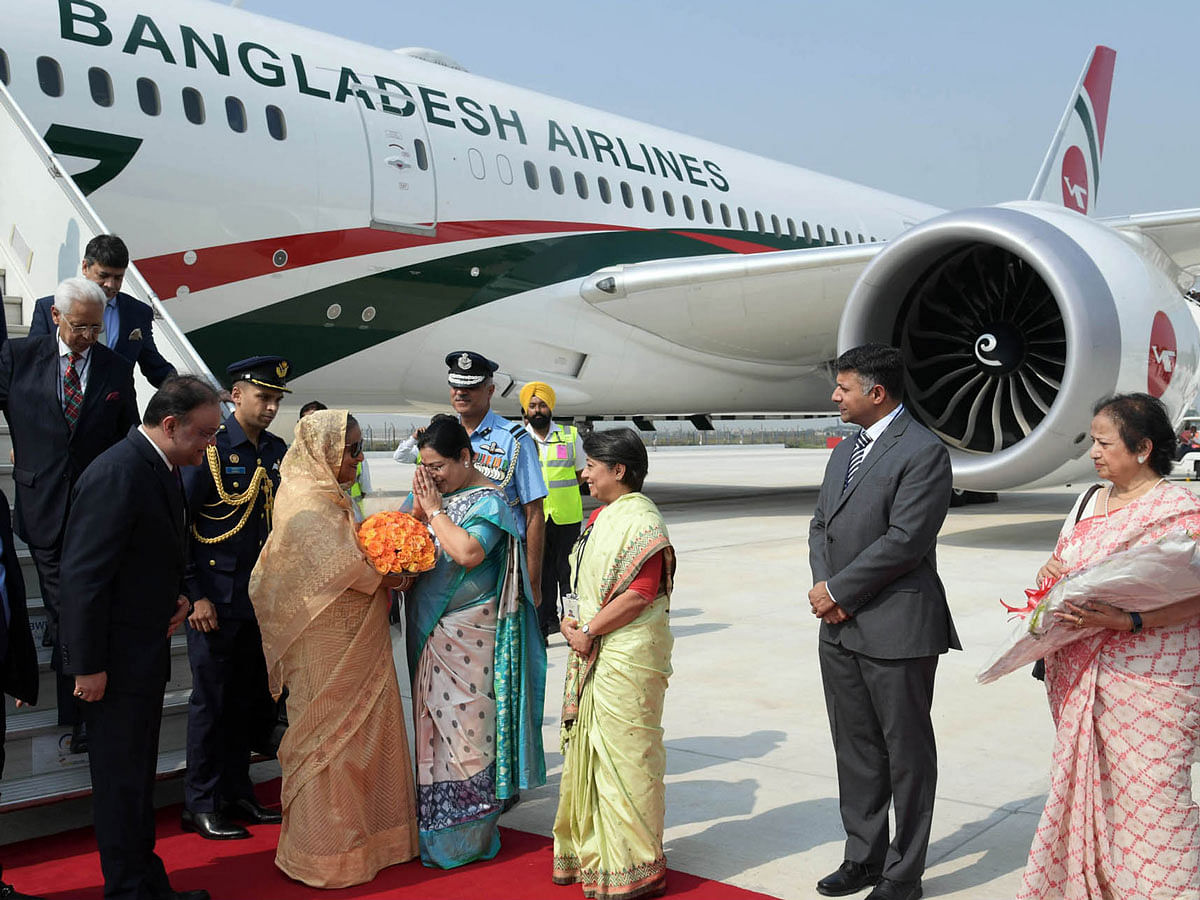 India’s state minister for child and women development Deboshree Chudri receives prime minister Sheikh Hasina at Palam Air Force Station, New Delhi, India on Thursday. Photo: PID