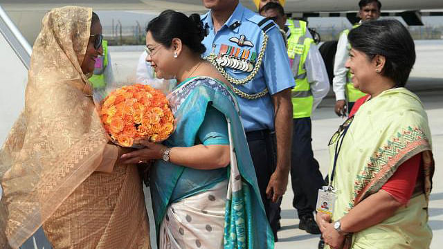 Indian state minister for child and women development Deboshree Chudri receives prime minister Sheikh Hasina at Palam Air Force Station, New Delhi on Thursday. Photo: PID