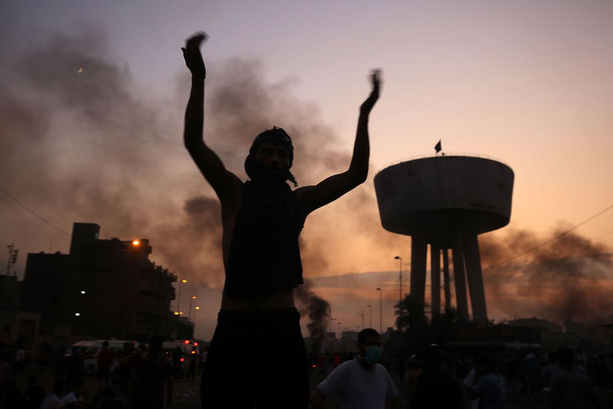 An Iraqi protester chants slogans during a demonstration against state corruption, failing public services and unemployment at Tayaran square in Baghdad on 2 October 2019. Photo: AFP