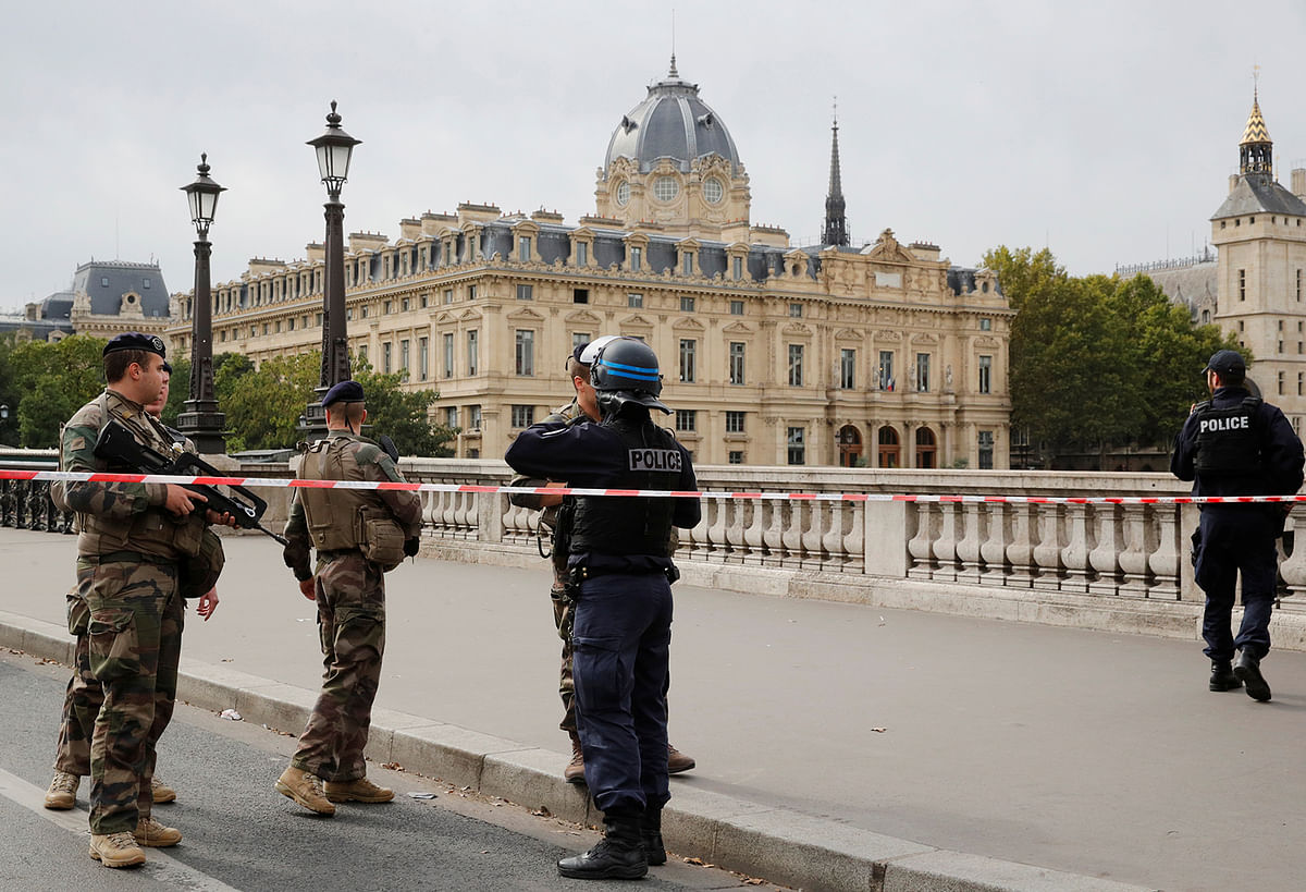 French police secure the area in front of the Paris Police headquarters in Paris. Photo: Reuters