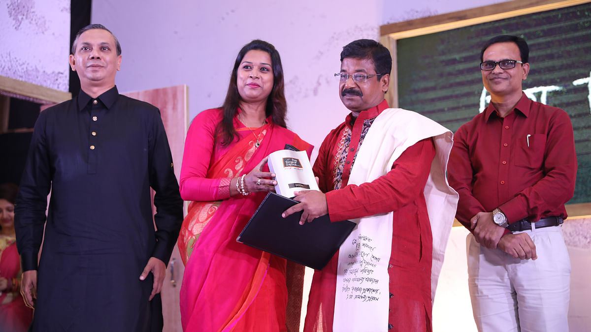 Tarapada Das, former teacher of Jashore`s Shommiloni Institution, achieved the honour. His son Dipankar Das received the award on his behalf. Photo: Prothom Alo