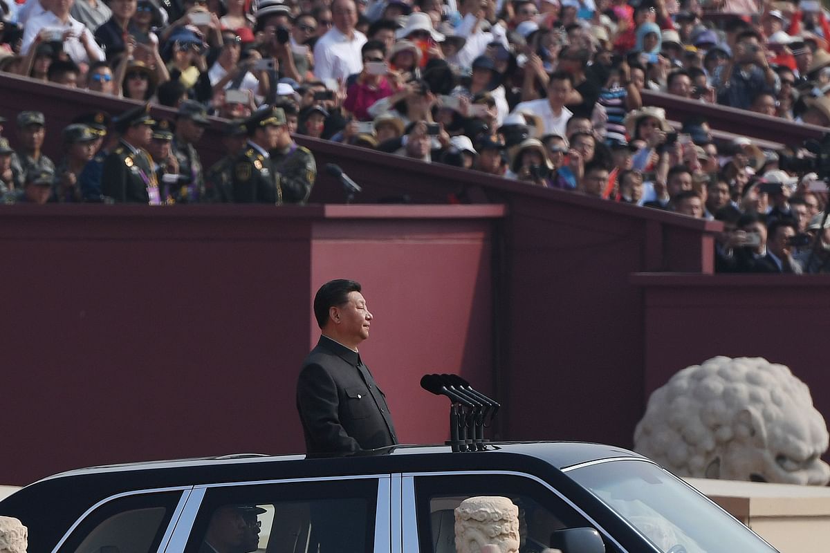 Chinese president Xi Jinping begins a review of troops from a car during a military parade at Tiananmen Square in Beijing on 1 October 2019, to mark the 70th anniversary of the founding of the People`s Republic of China. Photo: AFP