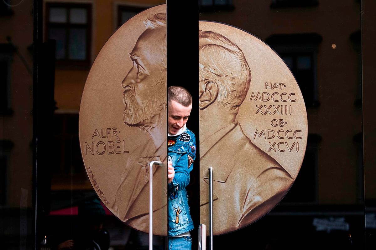 A man opens the door of the Alfred Nobel Museum in Stockholm, Sweden on 4 October 2019. The `Nobel week` of announcements will begin on 7 October 2019 with the Physiology or Medicine prize. Photo: AFP