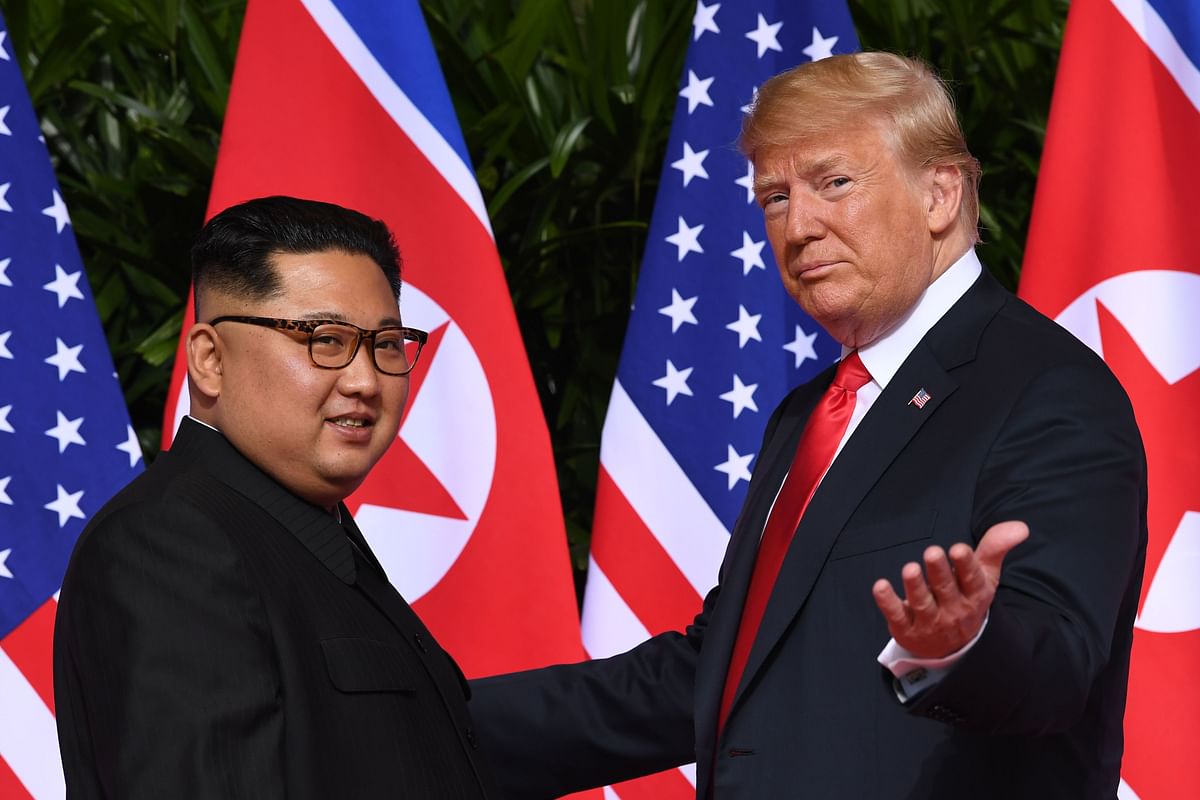 In this file photo taken on 12 June 2018 US president Donald Trump (R) meets with North Korea`s leader Kim Jong Un (L) at the start of their US-North Korea summit, at the Capella Hotel on Sentosa Island in Singapore. Photo: AFP