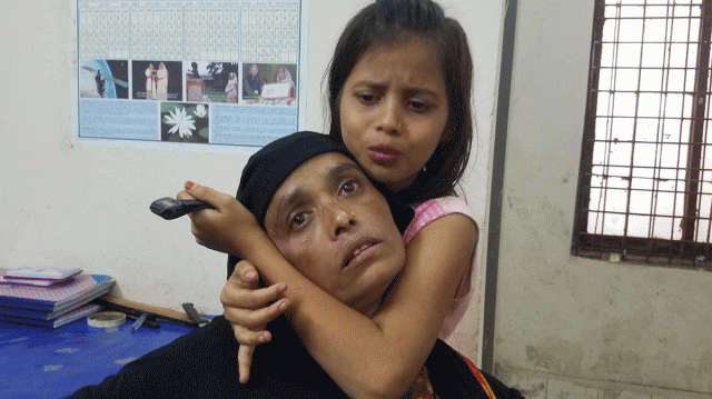 Two relatives of the victims mourn. Four members of a family are killed when a thunderbolt strikes them in Boro Station area in Chandpur town on 6 October 2019. Photo: Alam Palash