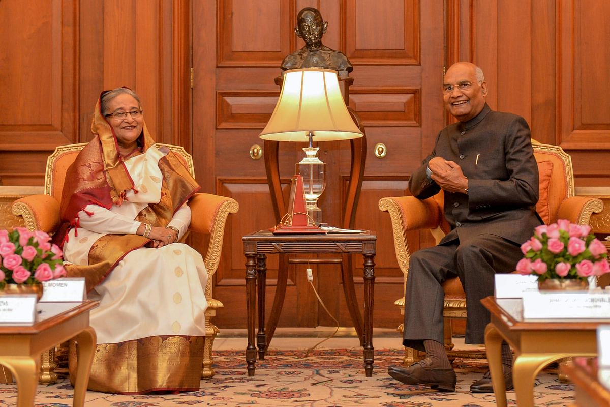 In this handout photograph taken and released by the Indian Presidential Palace on 5 October 2019, Bangladesh`s prime minister Sheikh Hasina (L) poses for photographs along with India`s president Ram Nath Kovind at `Rashtrapati Bhavan` presidential palace in New Delhi. AFP Photo/India`s presidential palace