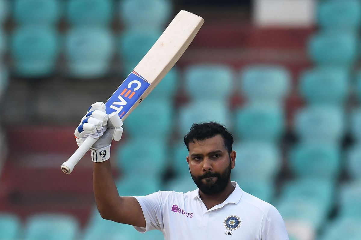 Indian cricketer Rohit Sharma raises his bat after scoring 100 runs during the fourth day`s play of the first Test match between India and South Africa at the Dr. YS Rajasekhara Reddy ACA-VDCA Cricket Stadium in Visakhapatnam on 5 October 2019. Photo: AFP