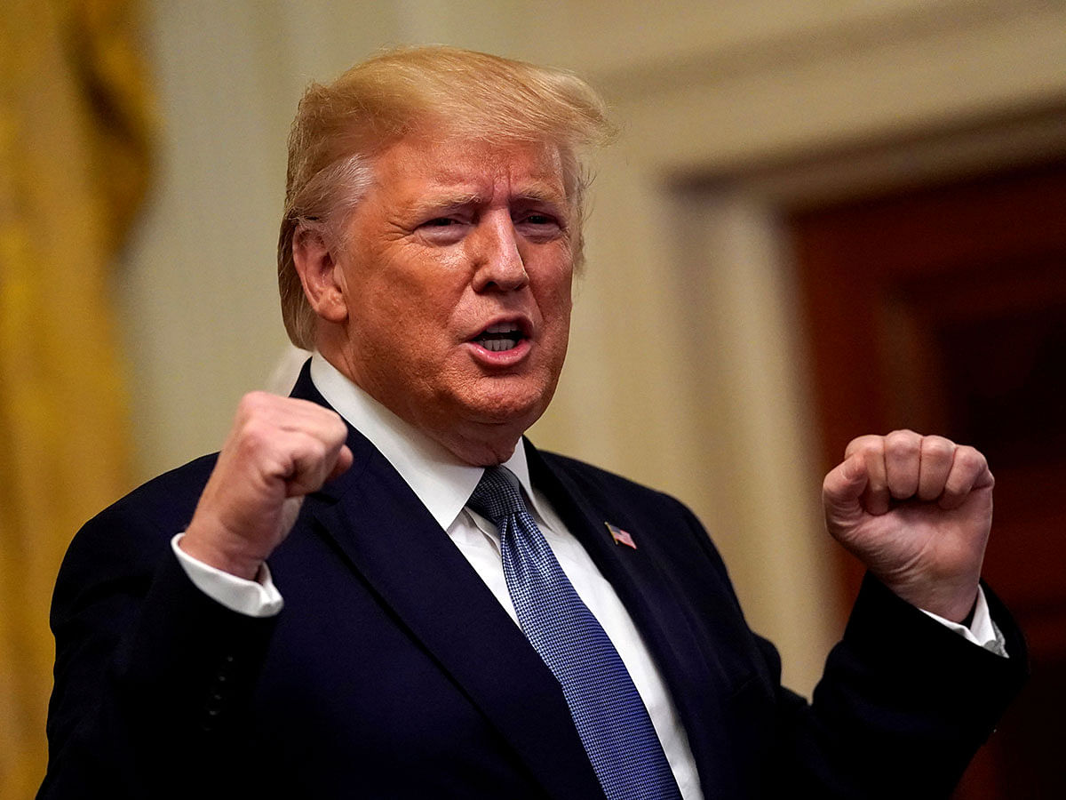 US president Donald Trump greets the audience before delivering remarks at Young Black Leadership Summit at the White House in Washington, US, on 4 October. Photo: Reuters