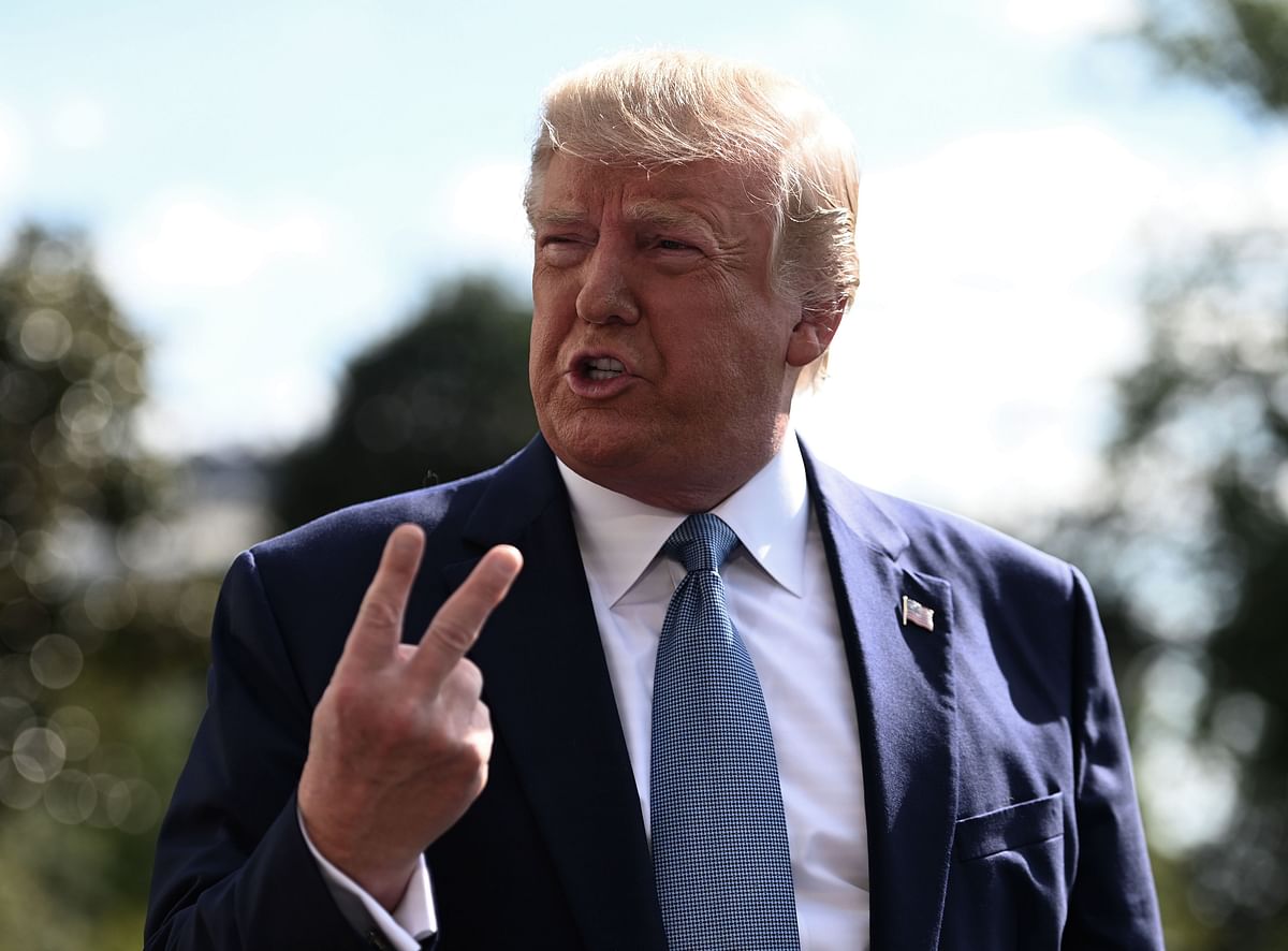 In this file photo taken on 4 October 2019 US president Donald Trump speaks to the press as he departs the White House in Washington, DC, for his annual visit to Walter Reed National Military Medical Center. Photo: AFP