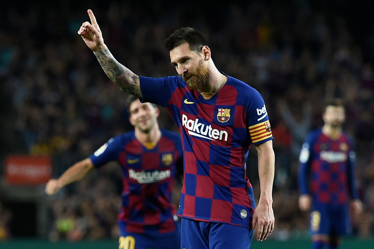 Barcelona`s Argentine forward Lionel Messi celebrates his goal during the Spanish league football match between FC Barcelona and Sevilla FC at the Camp Nou stadium in Barcelona on Sunday. Photo: AFP