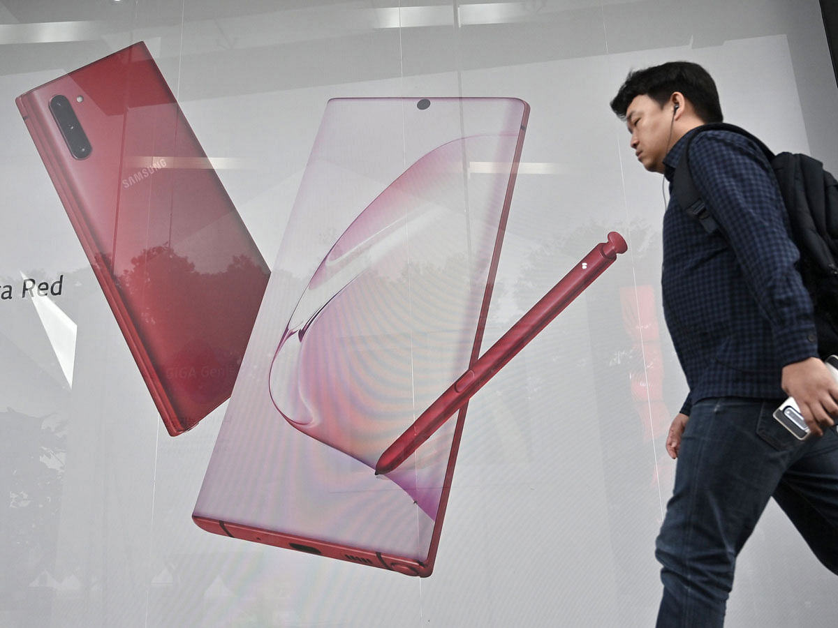 A man walks past an advertisement for the Samsung Galaxy Note10 5G smartphone in Seoul on 8 October 2019. AFP file photo